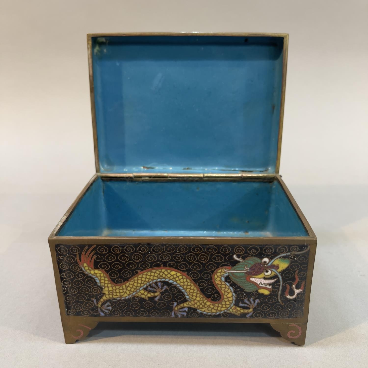 A CHINESE CLOISONNE CASKET, rectangular, the black ground with opposing dragons chasing the - Image 3 of 3
