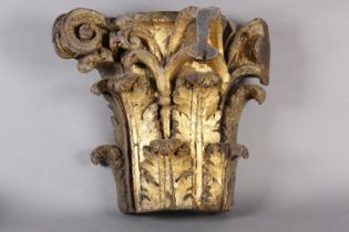 AN 18TH CENTURY GILDED OAK CAPITOL, carved with acanthus and scrollwork, 39cm high x 42cm wide (