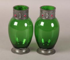 A PAIR OF ART NOUVEAU PEWTER MOUNTED GREEN GLASS VASES, the mount to the neck embossed with a frog