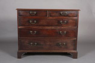 A GEORGE III MAHOGANY CHEST of two short and three long graduated drawers, cockbeaded, gilt metal
