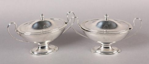 A PAIR OF GEORGE III SILVER SAUCE TUREENS with domed covers, London 1780 maker's mark DSRS, beaded