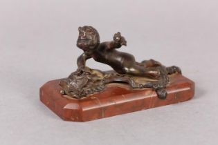 A LATE 19TH CENTURY COLD PAINTED BRONZE FIGURE of an infant girl and butterfly, on red marble