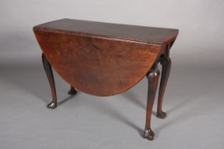 A GEORGE III MAHOGANY PEMBROKE DINING TABLE, oval, having twin drop leaves, arched apron, on