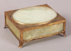 A LATE 19TH CENTURY CHINESE EXPORT GILT METAL AND JADE CASKET, the cover with raised oval panel, the