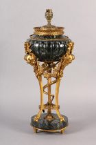 A FRENCH DARK GREEN MARBLE AND GILT METAL TABLE LAMP, raised on three legs with bearded face mask