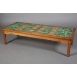 AN OAK COFFEE TABLE, Acorn Man, inset with Art Nouveau green and mauve tiles, rectangular, on