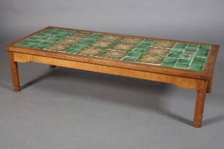 AN OAK COFFEE TABLE, Acorn Man, inset with Art Nouveau green and mauve tiles, rectangular, on