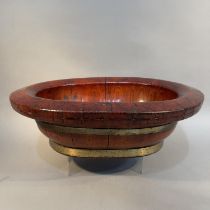 A CHINESE LACQUERED WOOD AND BRASS BOUND WASH BOWL, Qing, oval, with broad rim, c1900, 51cm x 42cm x