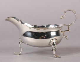A GEORGE III SILVER SAUCEBOAT, London 1761 possibly for Richard Meach, engraved with a crest, having
