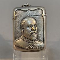 AN EDWARD VII COMMEMORATIVE BASE METAL VESTA, embossed with a head and shoulders portrait of Edward,