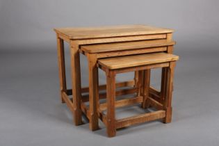 THOMPSON OF KILBURN 'MOUSEMAN', A nest of three oak occasional tables on an octagonal and square