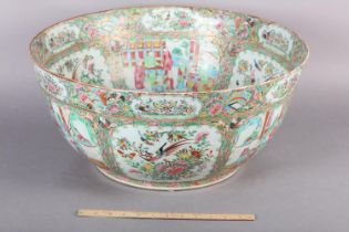 AN EXCEPTIONALLY LARGE CANTON FAMILLE ROSE PUNCH BOWL, 19th century, painted with dignitaries and