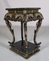 A CHINESE BLACK LACQUERED TABLE OR STAND, Qing, the rectangular top painted in iron red, green