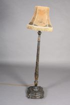 AN EBONISED AND GILT CHINOISERIE STANDARD LAMP, turned column on a square triple stepped base of