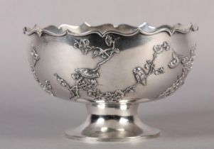 A CHINESE SILVER BOWL, circular with bracketed rim and applied with birds amongst branches of cherry