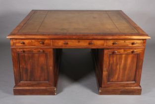 A 19TH CENTURY FIGURED MAHOGANY PARTNER'S DESK, c1830, having a green leather incised writing