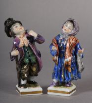 A PAIR OF LATE 19TH/EARLY 20TH CENTURY, GERMAN PORCELAIN FIGURES of begging children, a girl with