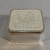A RUSSIAN SILVER TRINKET BOX 1908-1915, of square canted outline, the cover embossed with