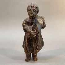 AN 18TH/19TH CENTURY CARVED AND MONOCHROME PAINTED FIGURE OF AN APOSTLE, holding a scroll, 13cm high