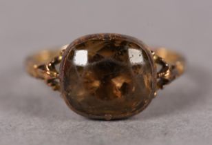 A WILLIAM IV SINGLE STONE SMOKY QUARTZ RING in 9ct gold, the foil backed cushion-shaped faceted