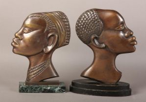 TWO EARLY 20TH CENTURY BRONZE PROFILES OF AN AFRICAN TRIBESMAN AND WOMAN, after Hagenau, coppered