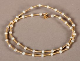 A SEED PEARL NECKLACE in 9ct gold, the 4mm pearls separated by fluted spacers, A/F, approximate