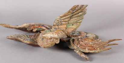 AN 18TH/EARLY 19TH CENTURY POLYCHROME PAINTED PINE CARVING OF A PHOENIX AMONGST CLOUDS, 58cm wide