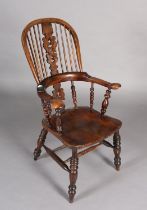 A 19TH CENTURY YEW-WOOD WINDSOR HIGH BACK ARMCHAIR, having a pierced and scrolled profile, broad
