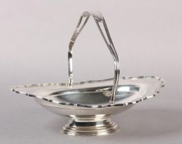 A GEORGE V SILVER FRUIT BASKET, Chester 1916, by Barker Bros, of oval outline with wavy rim, pierced