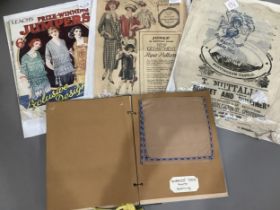 Two pattern magazines and a selection of branded packaging c1900 and a folder containing