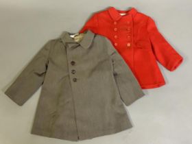 A 1950’s wool Rob Roy red peacoat, having two scalloped pockets age 18 months together with