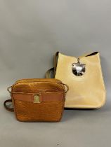 Salvatore Ferragamo: A tan leather, croc effect cross body bag, with pocket to front, gold hardware,