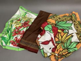 A Jim Thompson multi coloured scarf printed with orchids, a gentleman's dark wine patterned scarf