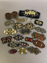 20th century buckles, various, to include filagree, cloisonné, shaped and embossed metal, one pair