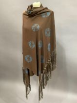 A brown silk shawl with long fringe tie-dyed with a large circular motif and smaller circles in