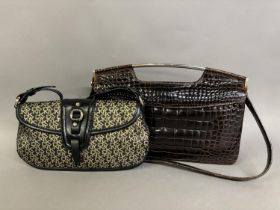 A DKNY gold and black monogrammed shoulder bag together with a Michele France brown leather croc