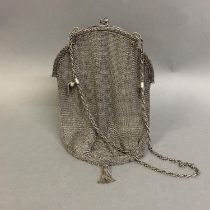 A 19th century white metal mesh bag, with fine chain mesh, the clasp formed of two flower buds