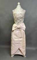 Attributed to Pedro Rodriguez of Madrid: a soft pink moire silk couture gown with front panel tucked