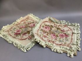 A pair of Chelsea Textile petit and gros point cushions, roses and summer blooms within a scrollwork