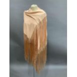 Am apricot silk piano shawl with long fringe, approximate 116cm square excluding fringe two holes