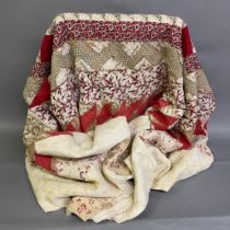 A 19th century patchwork quilt, pieced from good floral fabrics, worked in concentric bands, the