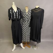 1930’s to 1940’s: three dresses, the first long, in black and cream crepe printed in a very