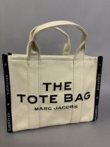 Marc Jacobs, The Tote Bag: cream and black with top handles and detachable shoulder or cross-body