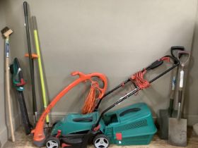 A Bosch electric lawn mower, Flymo strimmer and together with other gardening tools