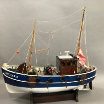 A model fishing vessel with masts and rigging