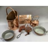 A copper coal hod, two coppered tin dishes, copper kettle of oval outline, two copper chestnut