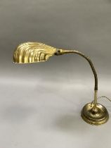 A reproduction shell desk lamp