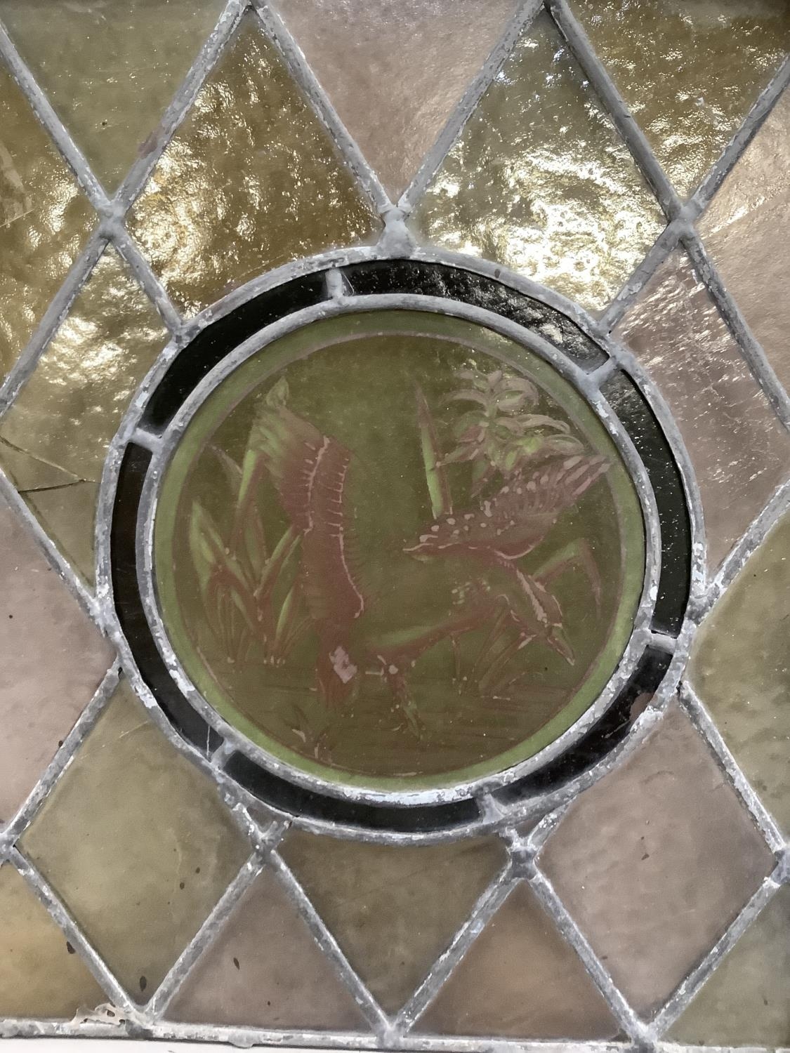 A Victorian leaded glass panel, the circular panel painted to the centre with a duck alighting on - Image 2 of 3