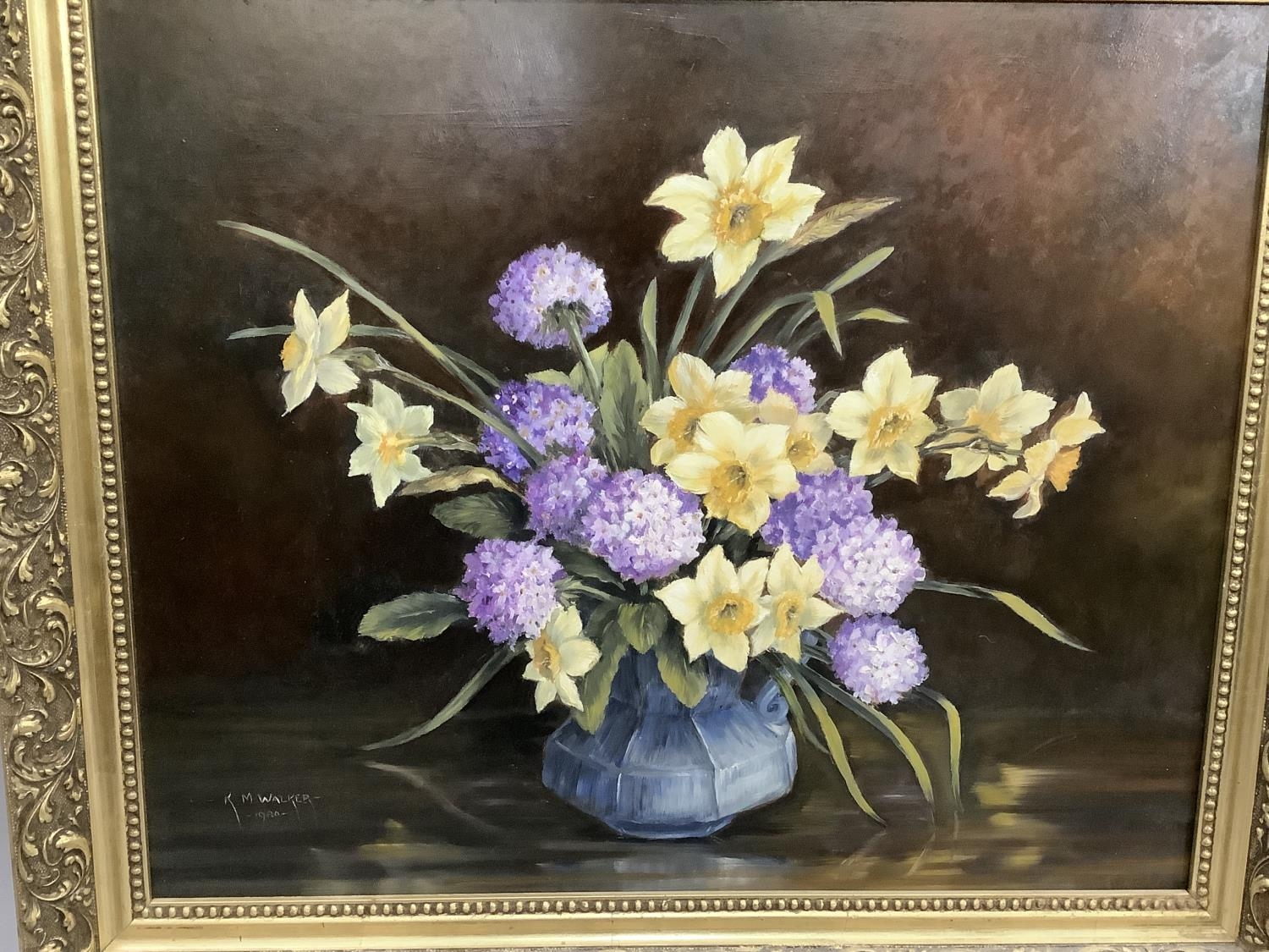 K.N. Walker still life of daffodils and primula pom-poms held in a pottery jug, oil on board, signed - Image 2 of 4