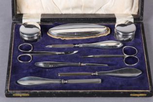 A George V nine piece silver manicure set Birmingham 1923 for Hasset & Harper Ltd, in fitted case (